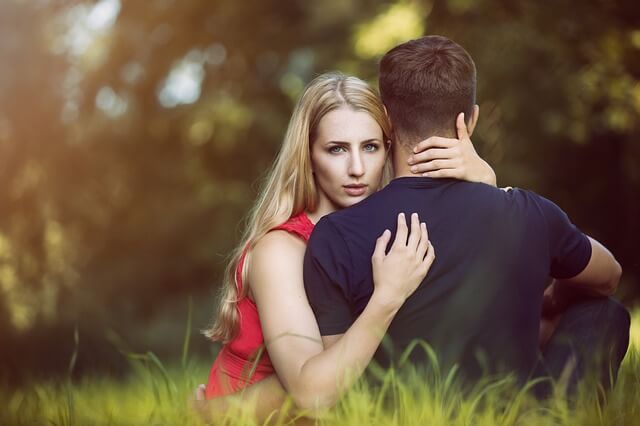guy and girl in a relationship hugging outside